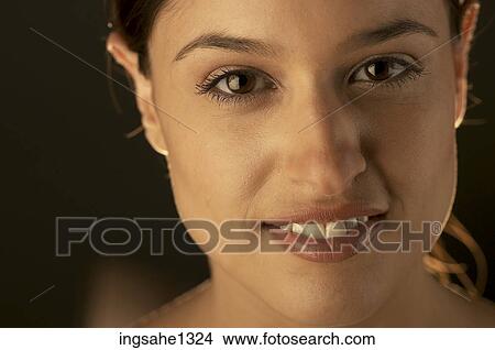 Close up of young woman's smiling face View Large Photo Image Picture - Close up of young woman's smiling face. Fotosearch