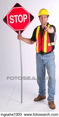 Construction worker holding out stop sign View Large Photo Image Stock Image - Construction worker holding out stop sign. Fotosearch