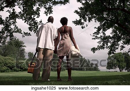 Couple having picnic in park View Large Photo Image Stock Photography - Couple having picnic in park. Fotosearch