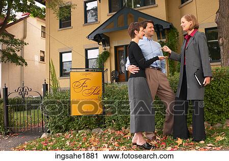 Couple with real estate agent BE 16 View Large Photo Image Stock Image - Couple with real estate agent BE 16. Fotosearch