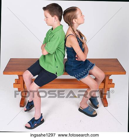 Fighting children sitting on bench View Large Photo Image Stock Photo - Fighting children sitting on bench . Fotosearch