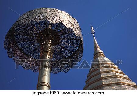 Golden umbrella and tower View Large Photo Image Stock Photo - Golden umbrella and tower. Fotosearch