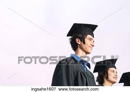 Graduates wearing hats watching ceremony View Large Photo Image Stock Photo - Graduates wearing hats watching ceremony . Fotosearch
