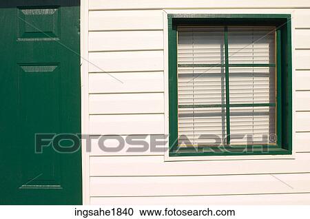 Stock Image - Green door and window BE. Fotosearch