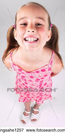 Grinning little girl View Large Photo Image Stock Photo - Grinning little girl . Fotosearch