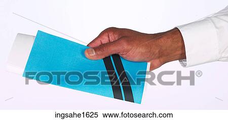 Stock Photography - hand holding envelope and paper BE 1. Fotosearch