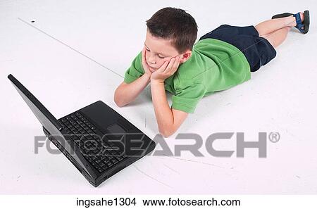 Little boy using laptop View Large Photo Image Picture - Little boy using laptop . Fotosearch
