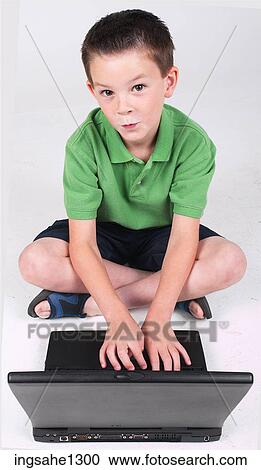 Little boy using laptop View Large Photo Image Stock Image - Little boy using laptop . Fotosearch