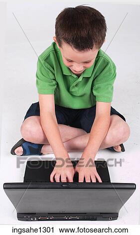 Little boy using laptop View Large Photo Image Stock Image - Little boy using laptop . Fotosearch