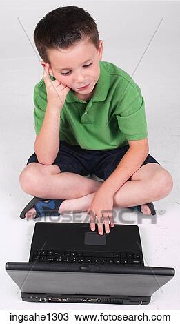 Little boy using laptop View Large Photo Image Stock Image - Little boy using laptop . Fotosearch