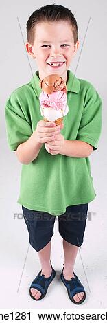 Stock Image - Little boy with ice cream cone . Fotosearch