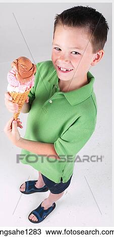 Little boy with ice cream cone View Large Photo Image Stock Image - Little boy with ice cream cone . Fotosearch