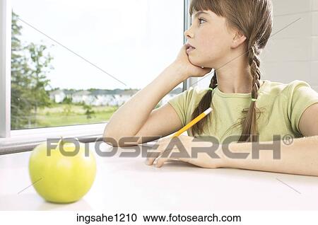 Little girl daydreaming out classroom window View Large Photo Image Stock Image - Little girl daydreaming out classroom window. Fotosearch