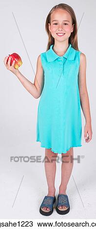 Stock Image - Little girl holding apple . Fotosearch