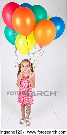 Little girl holding balloons View Large Photo Image Stock Photo - Little girl holding balloons . Fotosearch