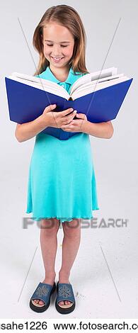 Little girl reading book View Large Photo Image Stock Photograph - Little girl reading book . Fotosearch