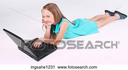 Little girl using laptop View Large Photo Image Stock Image - Little girl using laptop . Fotosearch