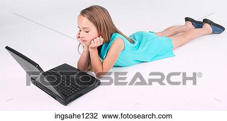 Little girl using laptop View Large Photo Image Stock Image - Little girl using laptop . Fotosearch