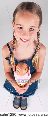 Little girl with ice cream cone View Large Photo Image Stock Image - Little girl with ice cream cone . Fotosearch