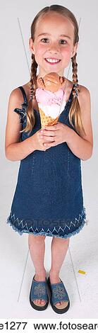 Little girl with ice cream cone View Large Photo Image Stock Photo - Little girl with ice cream cone . Fotosearch