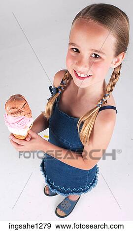 Little girl with ice cream cone View Large Photo Image Stock Photo - Little girl with ice cream cone . Fotosearch