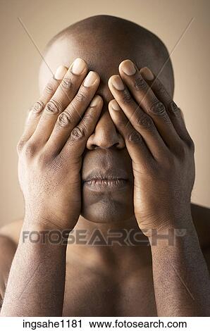 Man covering his eyes with his hands View Large Photo Image Stock Image - Man covering his eyes with his hands. Fotosearch
