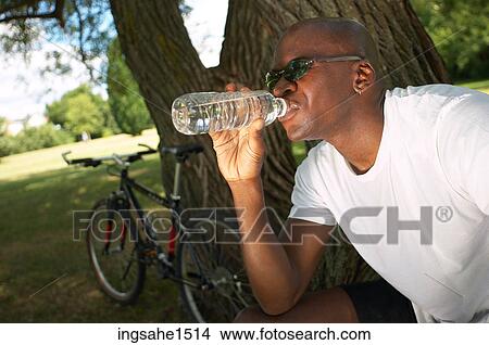 Man drinking water View Large Photo Image Picture - Man drinking water . Fotosearch