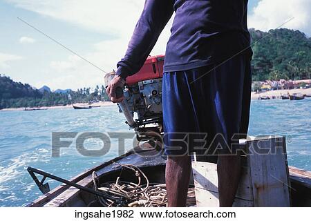 Man driving motor boat View Large Photo Image Stock Image - Man driving motor boat. Fotosearch
