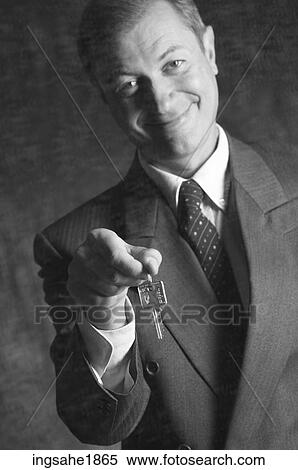 Man extending keys BE 4 View Large Photo Image Stock Photography - Man extending keys BE 4. Fotosearch