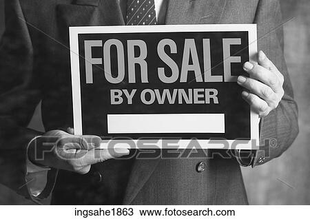 Man holding sign BE 2 View Large Photo Image Stock Image - Man holding sign BE 2. Fotosearch