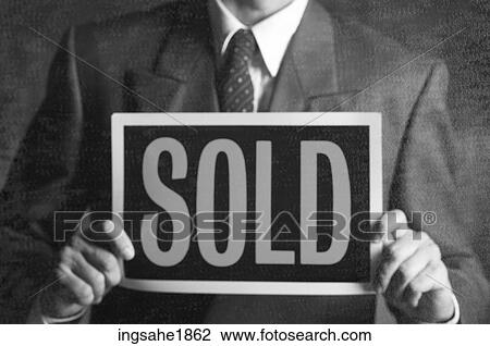 Man holding sold sign BE 2 View Large Photo Image Stock Image - Man holding sold sign BE 2. Fotosearch