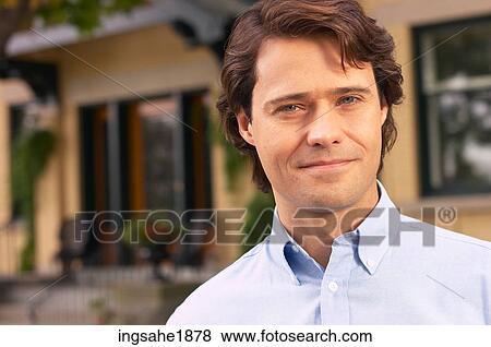Man in front of house BE View Large Photo Image Stock Photo - Man in front of house BE. Fotosearch