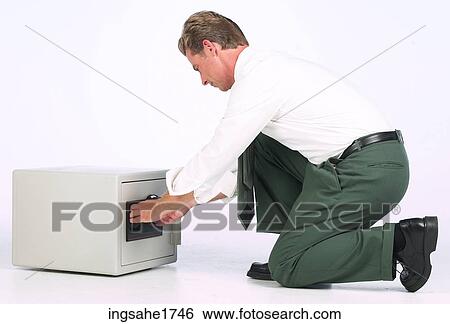 Man Opening Safe BE 3 View Large Photo Image Stock Photograph - Man Opening Safe BE 3. Fotosearch