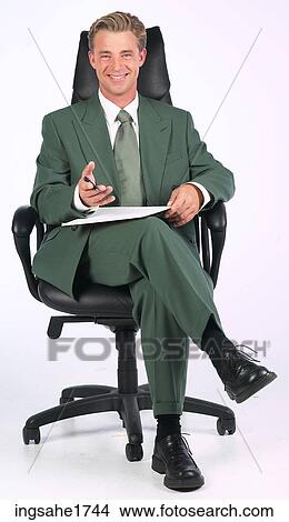 Man sitting in chair BE 2 View Large Photo Image Picture - Man sitting in chair BE 2. Fotosearch