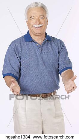 man standing with blue shirt View Large Photo Image Picture - man standing with blue shirt . Fotosearch