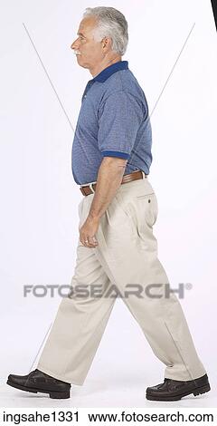 man standing with blue shirt View Large Photo Image Stock Image - man standing with blue shirt . Fotosearch