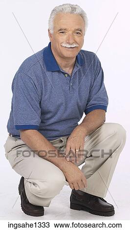 man standing with blue shirt View Large Photo Image Stock Image - man standing with blue shirt . Fotosearch