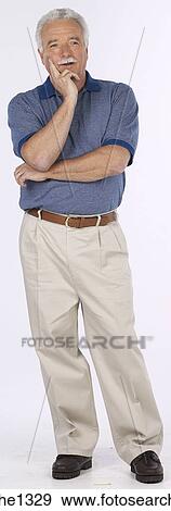 Stock Photo - man standing with blue shirt . Fotosearch