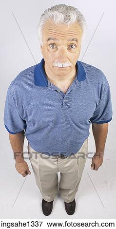 man standing with blue shirt View Large Photo Image Stock Photo - man standing with blue shirt . Fotosearch