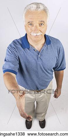 Stock Photo - man standing with blue shirt . Fotosearch