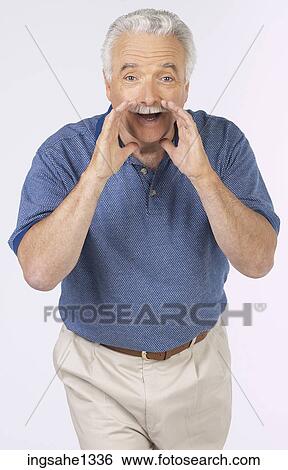 man standing with blue shirt View Large Photo Image Stock Photograph - man standing with blue shirt . Fotosearch