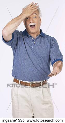 man standing with blue shirt View Large Photo Image Stock Photography - man standing with blue shirt . Fotosearch