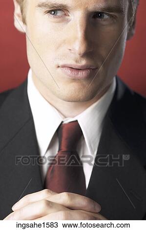 Man wearing suit and folding hands View Large Photo Image Stock Image - Man wearing suit and folding hands. Fotosearch