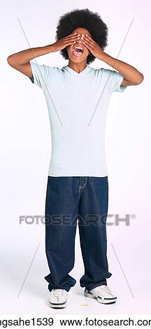 Man with afro covering eyes and yelling View Large Photo Image Stock Photo - Man with afro covering eyes and yelling. Fotosearch