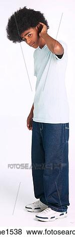 Stock Photo - Man with afro cupping ear. Fotosearch