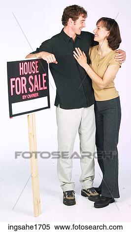 Man & Woman with sign BE 6 View Large Photo Image Stock Photography - Man & Woman with sign BE 6. Fotosearch