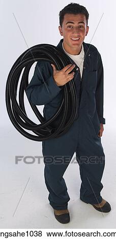 Stock Photo - Mechanic with rubber tubing. Fotosearch