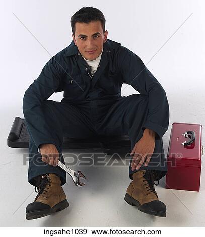 Stock Photo - Mechanic with wrench and toolbox a82. Fotosearch