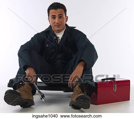 Stock Image - Mechanic with wrench and toolbox a83. Fotosearch