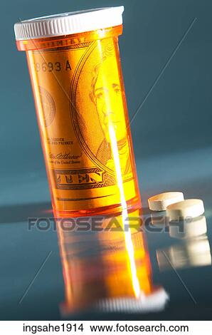 Picture - Pill bottle with cash inside BE 1. Fotosearch